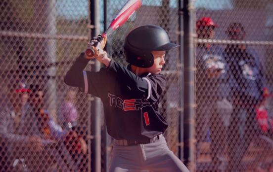 young baseball player up to bat