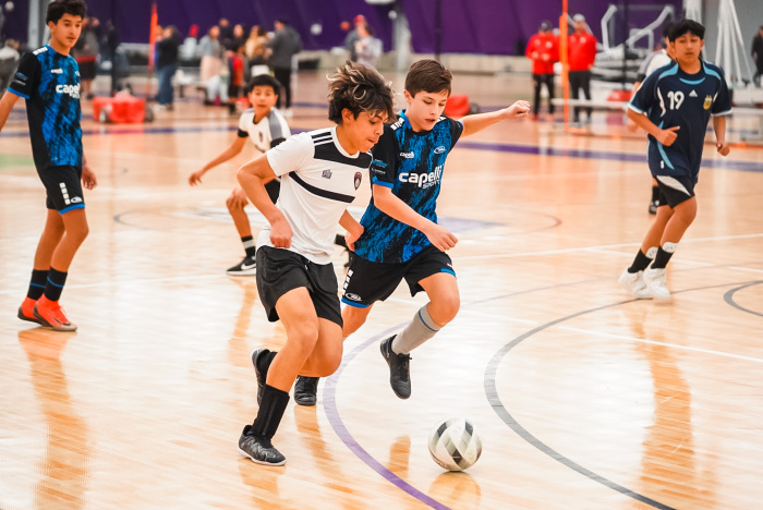 Boys playing futsal on the courts of Future Legends Sports Complex